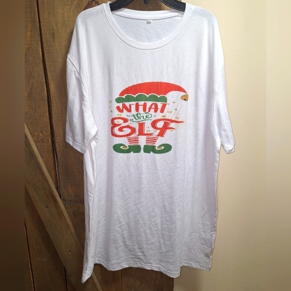 A Cricut "What The Elf" Christmas t-shirt in a men's size XL. Pre-loved